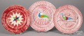 THREE RED SPATTER PLATES WITH