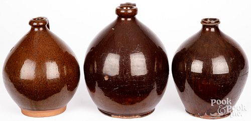 THREE REDWARE JUGS, 19TH C.Three