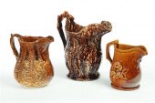 THREE ROCKINGHAM PITCHERS.  Ta