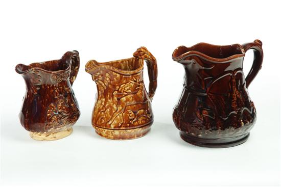 THREE ROCKINGHAM PITCHERS.  Two