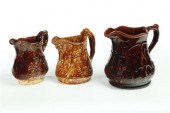 THREE ROCKINGHAM PITCHERS.  Tw