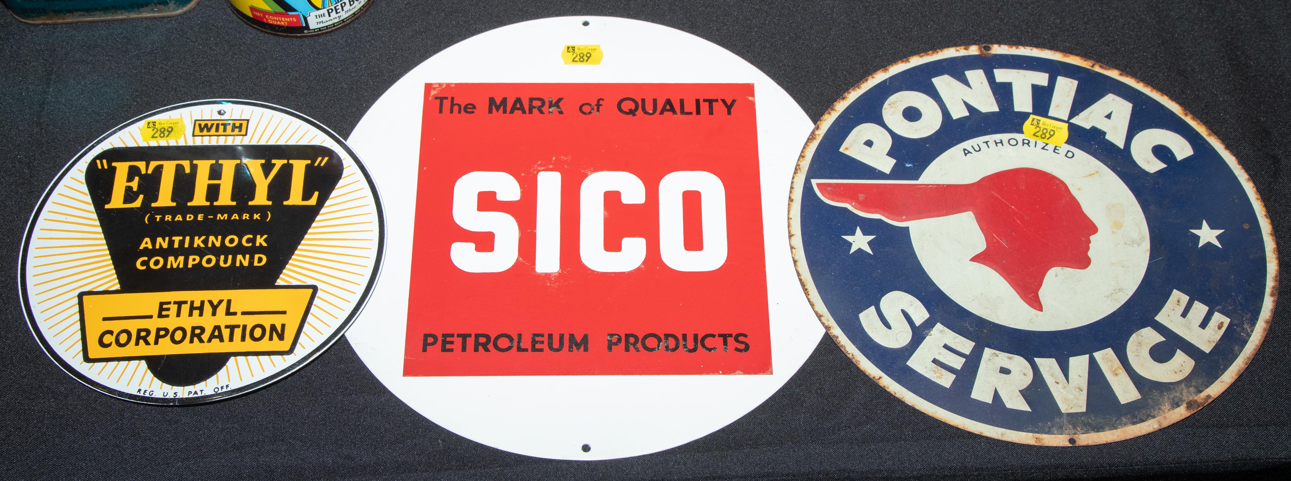 THREE ROUND AUTOMOTIVE SIGNS