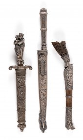 THREE SHEATHED SILVER DAGGERS