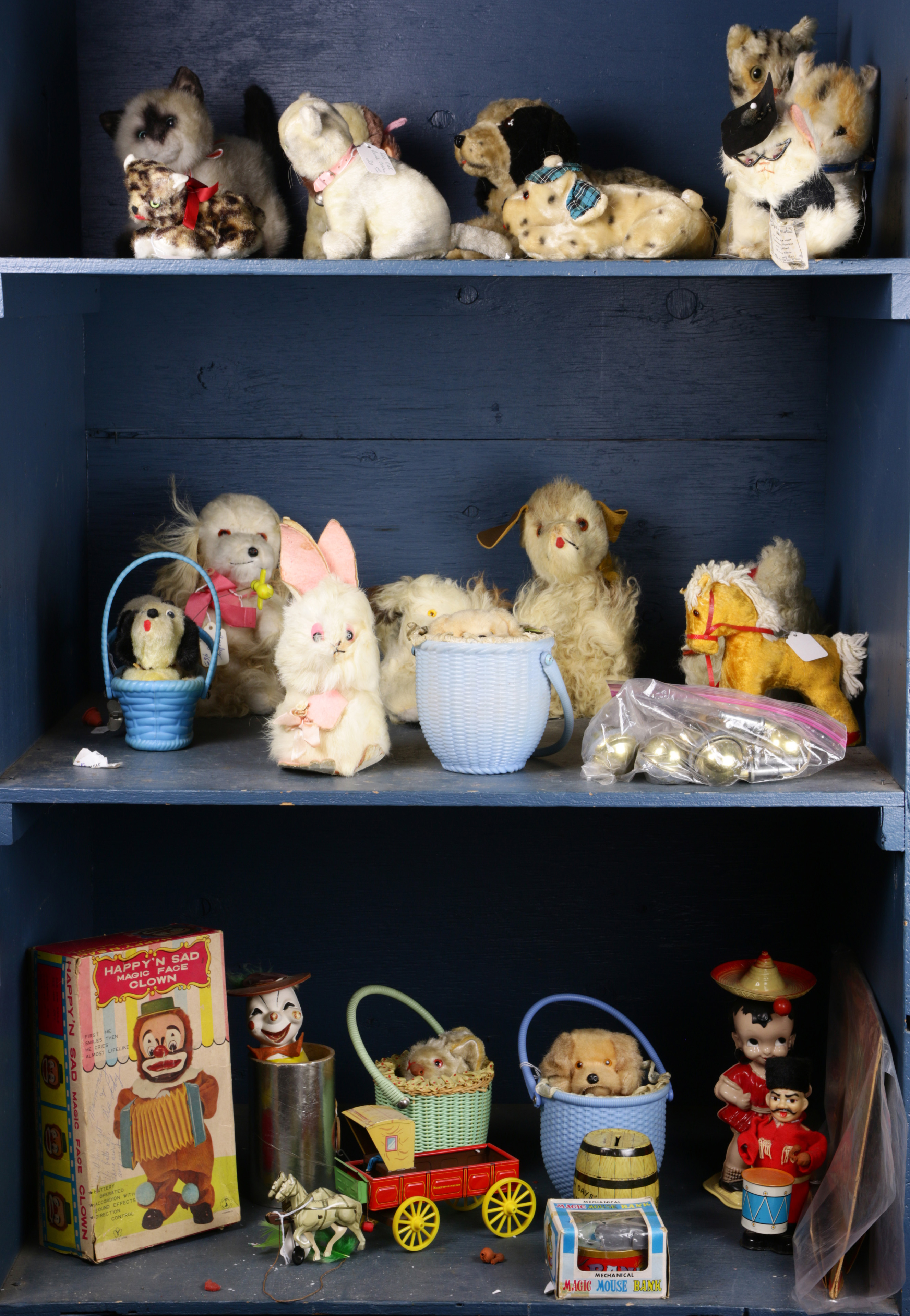 THREE SHELVES OF ANTIQUE STUFFED