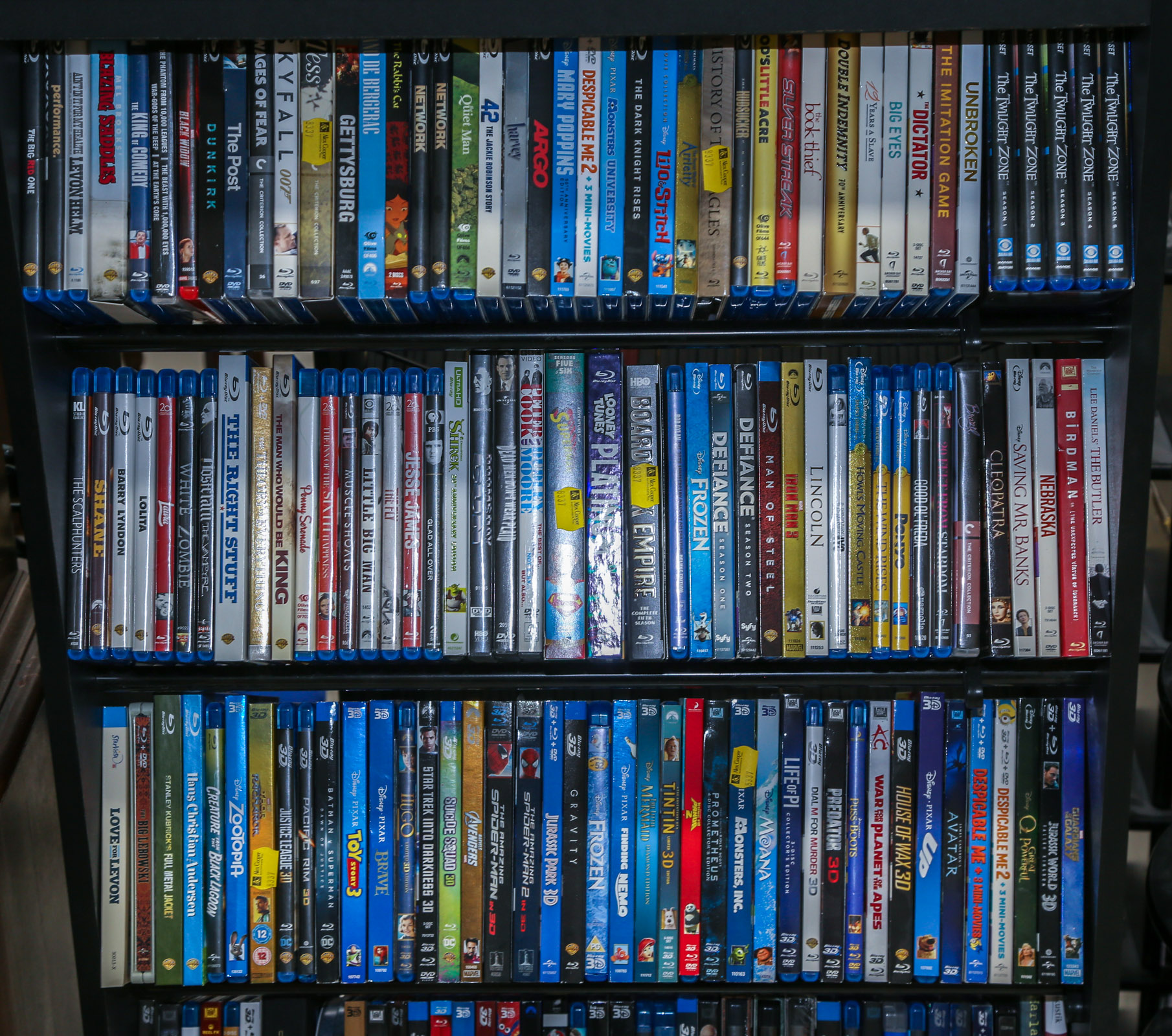 THREE SHELVES OF ASSORTED DVDS &