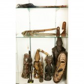 THREE SHELVES OF ETHNOGRAPHIC