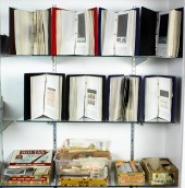 THREE SHELVES OF STAMPS Three