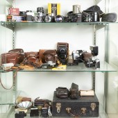 THREE SHELVES OF VINTAGE CAMER