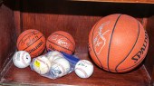 THREE SIGNED BASKETBALLS; FOUR