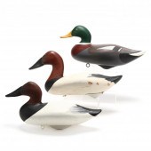 THREE SIGNED WOODEN DECOYS BY