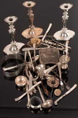 Three silver candlesticks, a silver