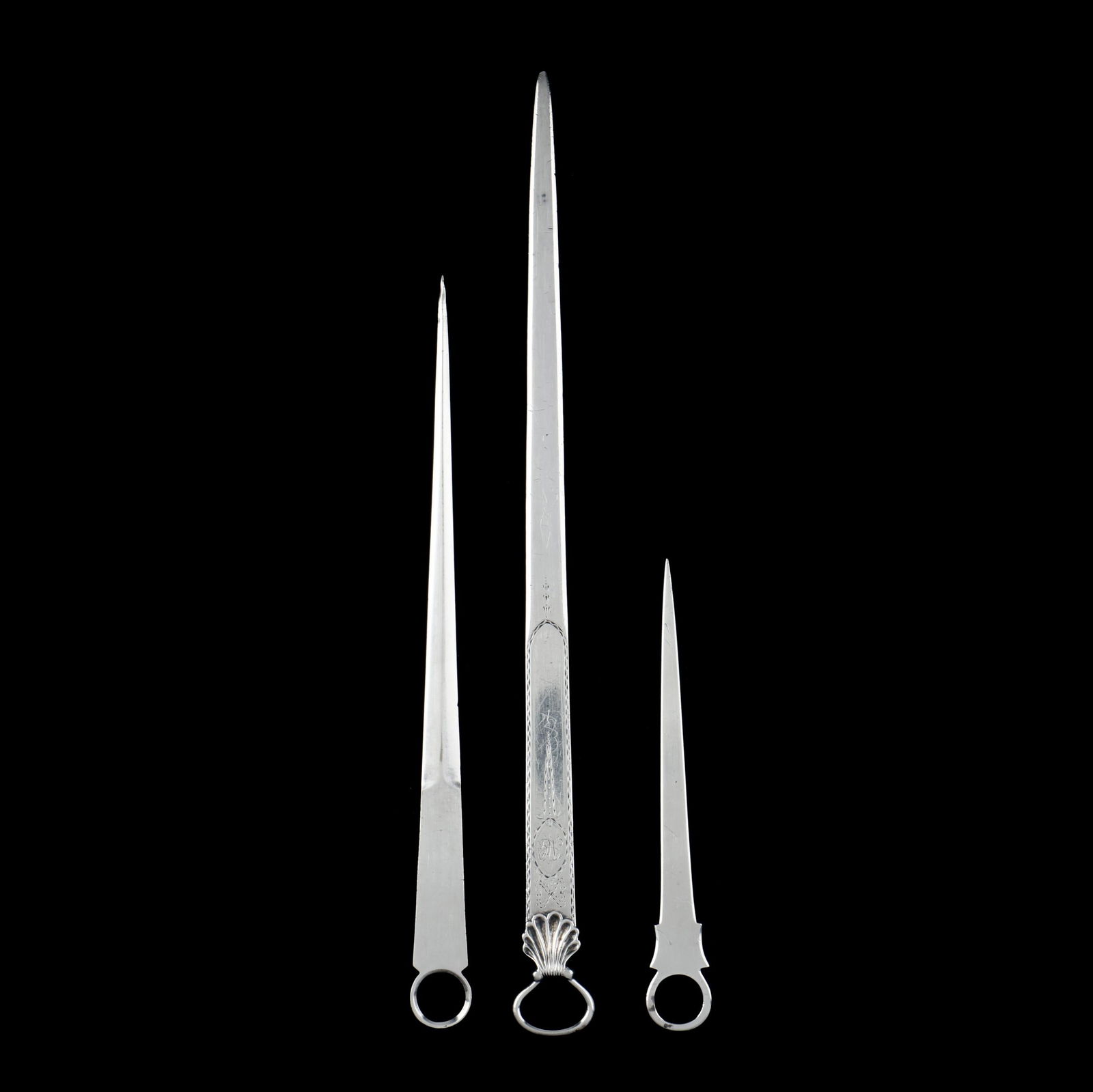 THREE SILVER MEAT SKEWERSThree
