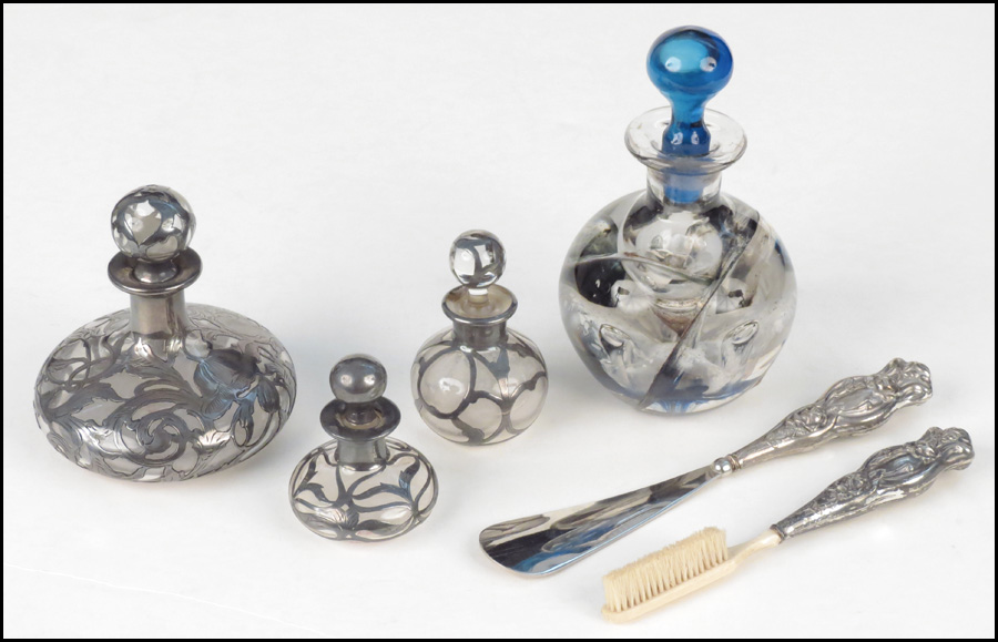THREE SILVER OVERLAY SCENT BOTTLES.