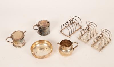 Three silver toast racks, two by