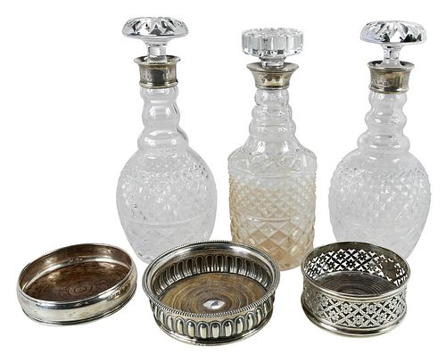 THREE SILVER WINE COASTERS AND