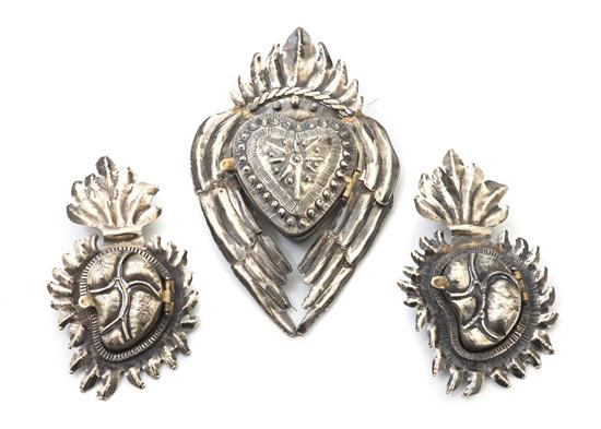 Three Silvered Brass Pendants