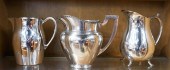 THREE SILVERPLATE PITCHERSThre