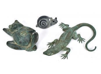 Three small figures, including: