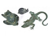 Three small figures, including
