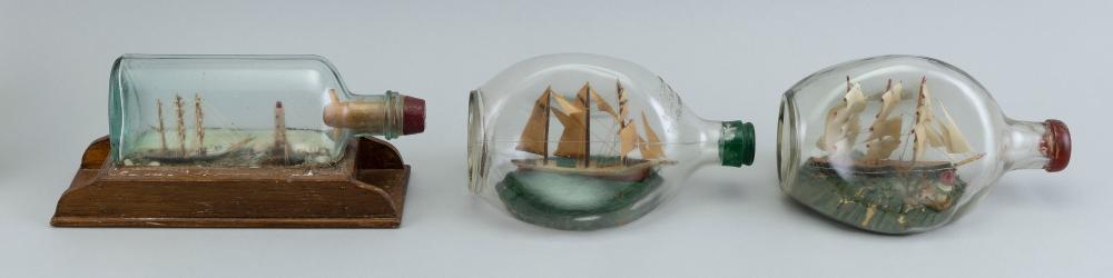THREE SMALL SHIPS IN BOTTLES