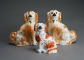THREE STAFFORDSHIRE SPANIELS,