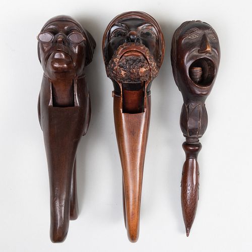 THREE STAINED AND CARVED WOOD