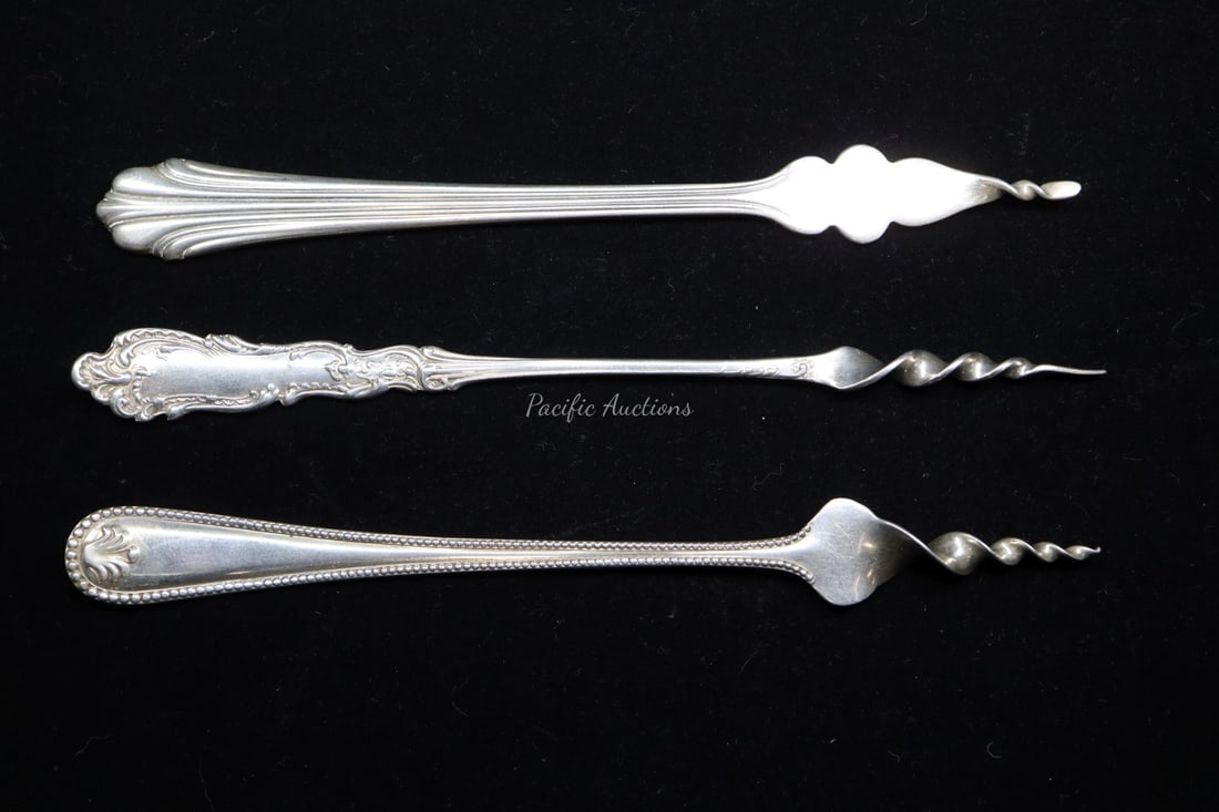 THREE STERLING SILVER BUTTER PICKS,