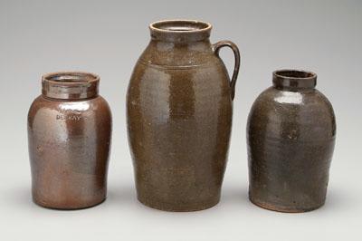 Three stoneware jars: one with