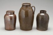 Three stoneware jars: one with