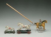 Three tin horse toys: two whit