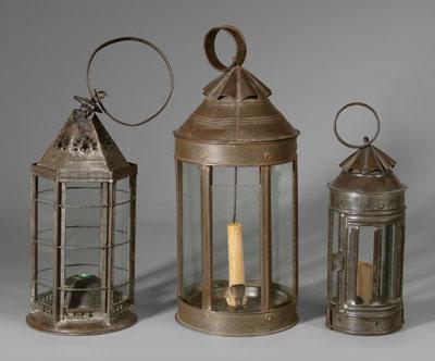 Three tin lanterns: two round