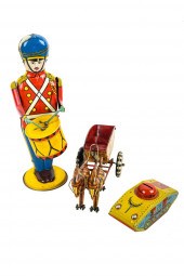 THREE TIN TOYSincluding a wind