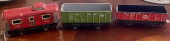 THREE TIN TRAIN CARS BY LOUIS