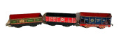 THREE TIN TRAIN CARS BY LOUIS