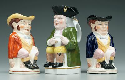 Three Toby jugs: one with green