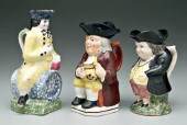 Three Toby jugs: seated Toby w