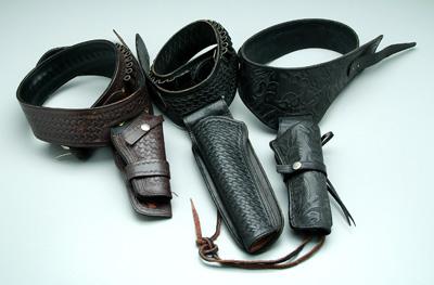 Three tooled leather belts,