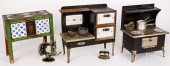 THREE TOY STOVES WITH VARIOUS