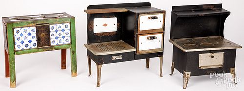 THREE TOY STOVESThree toy stoves,