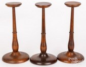 THREE TURNED WALNUT WIG STANDS