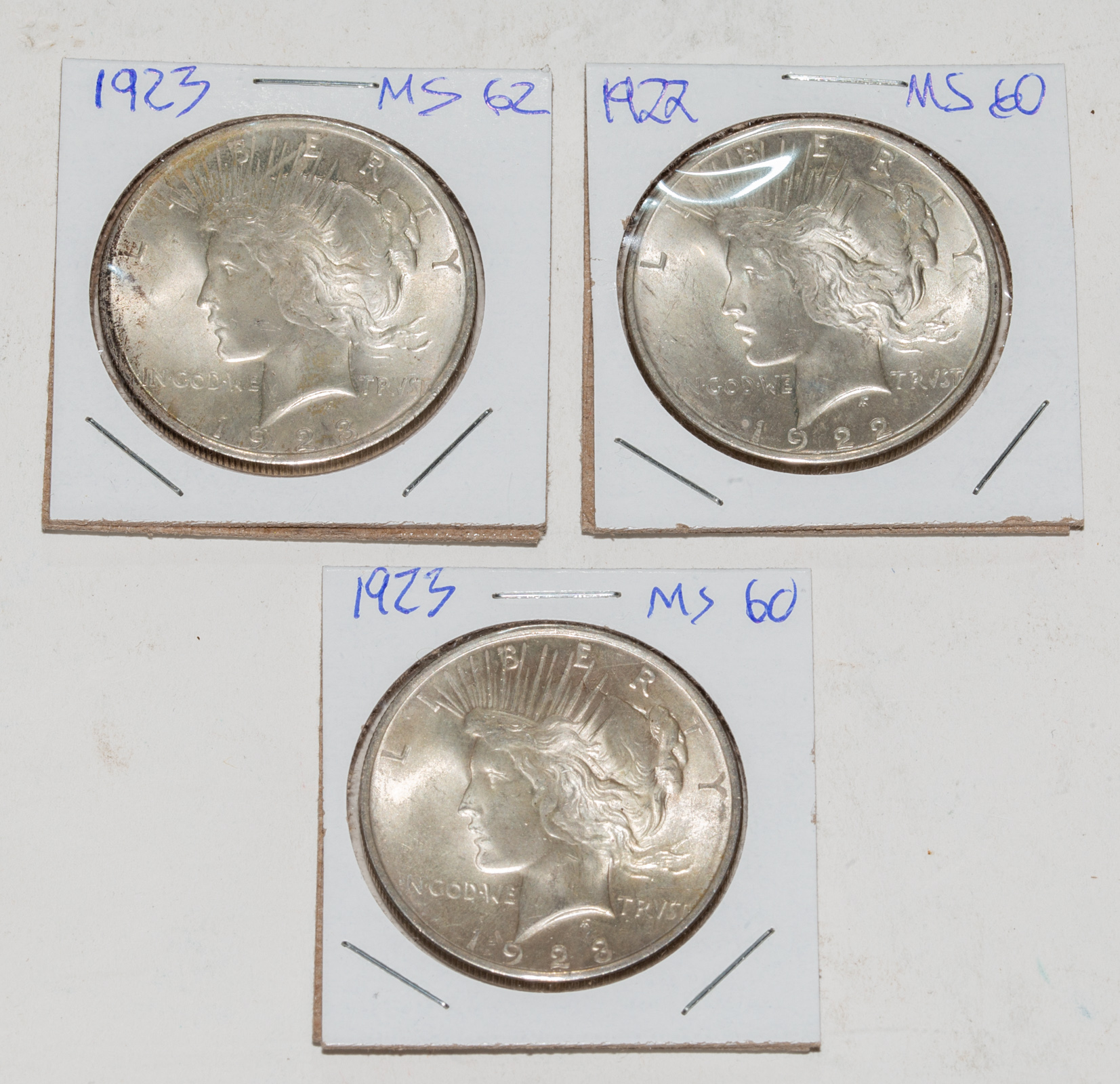 THREE UNCIRCULATED PEACE DOLLARS