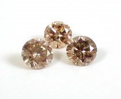THREE UNSET CHAMPAGNE DIAMONDS