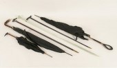 Three Victorian umbrellas, two