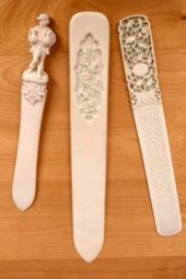 Three vintage carved bone busk