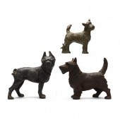 THREE VINTAGE CAST METAL DOG D