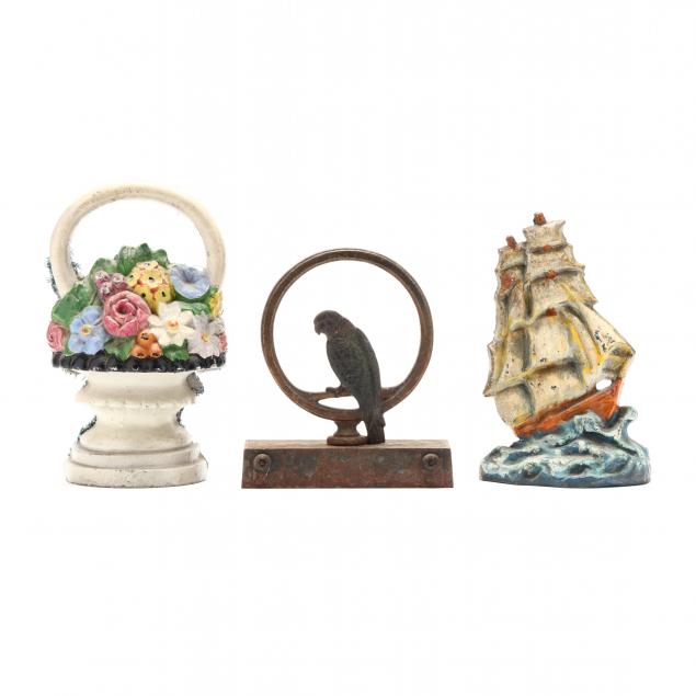THREE VINTAGE IRON DOORSTOPS