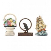 THREE VINTAGE IRON DOORSTOPS C