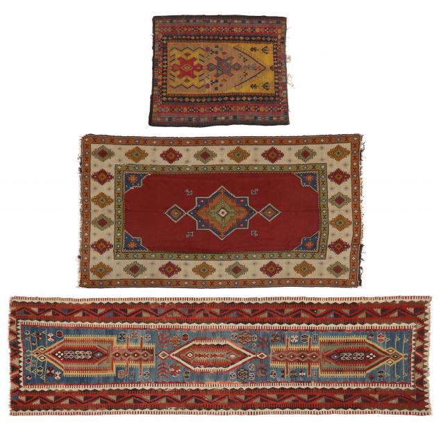 THREE VINTAGE KILIMS The first a