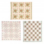 THREE VINTAGE QUILTS The first