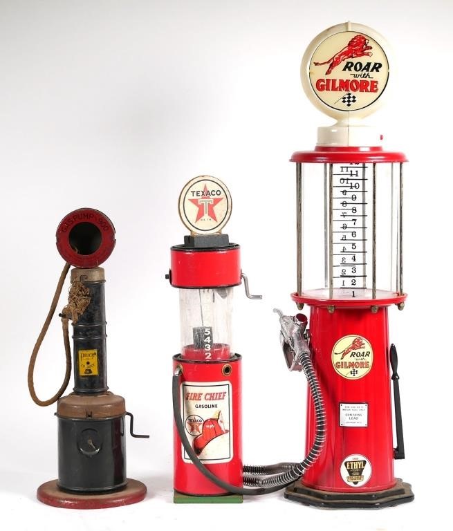 THREE VINTAGE TOY GAS PUMPSThree
